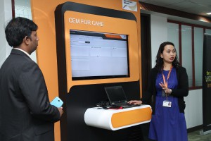 NSN employees show off CEM on Demand, a NSN offering that provides network operators the deepest possible understanding of their customers’ experiences, and helps to bridge the gap between customer satisfaction and network performance.